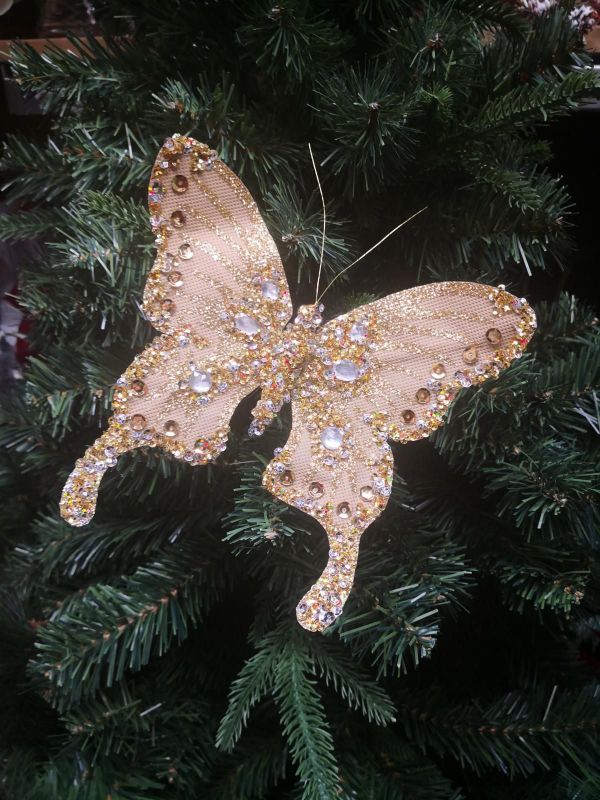 Large gold butterfly pendant adorned with sparkling diamonds, symbolizing beauty and transformation for elegant styling.