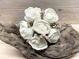 Elegant white artificial rose posies in a dry look, featuring six lifelike flowers, perfect for home or event decor.