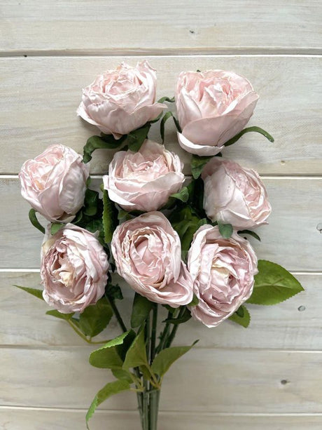 Artificial pink rose stems with a dry look, perfect for elegant home decor or events without maintenance.
