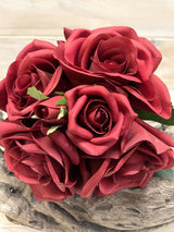 Artificial red rose posies that look and feel real, perfect for adding vibrant, maintenance-free beauty to any decor.