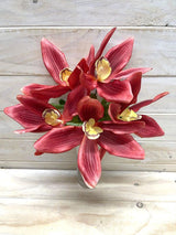 Burgundy artificial cymbidium orchid bush with realistic blooms, perfect for enhancing decor without maintenance.