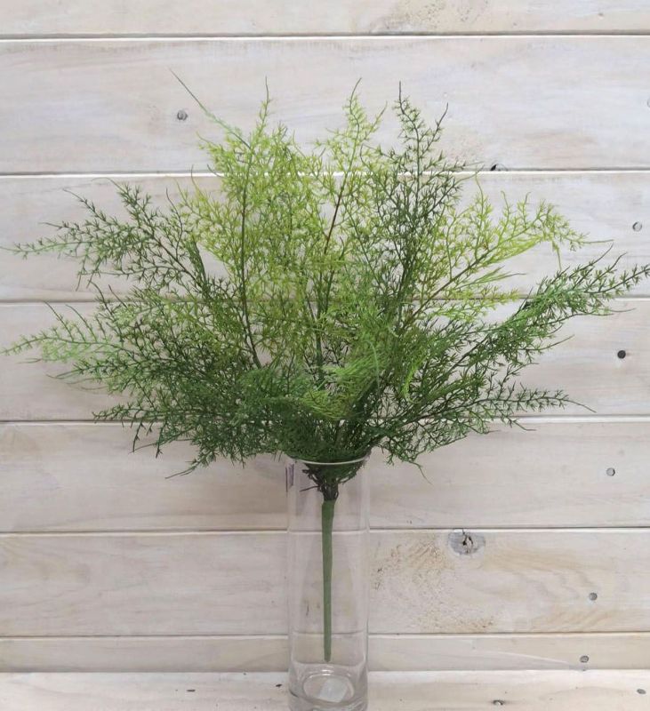 Lifelike green artificial leather fern bush, perfect for home decor and maintenance-free greenery.