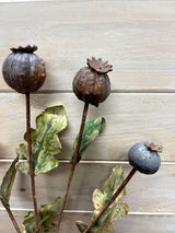 Vibrant artificial poppy seed spray, perfect for home decor or events, offering realistic beauty without maintenance.