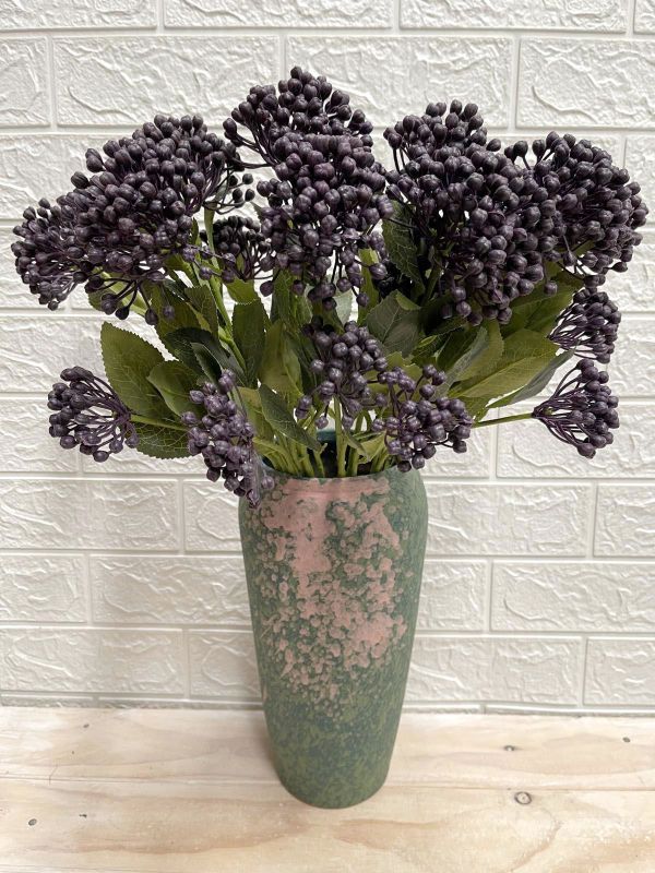 Vibrant purple artificial seed spray, perfect for home decor and events, adding color without maintenance.
