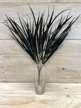 Black artificial grass bush, ideal for indoor/outdoor decor, low maintenance, stylish design, perfect for any setting.