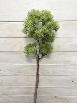 Lifelike green artificial bonsai spray, perfect for enhancing decor with elegance and low-maintenance greenery.