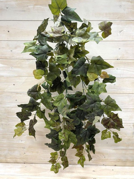 Lifelike green artificial hanging African ivy bush, perfect for indoor decor with no maintenance needed.