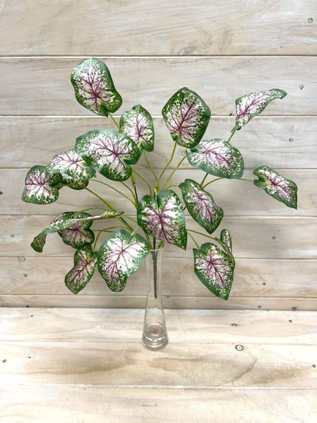 Lifelike artificial Caladium leaf bush with vibrant variegated leaves, perfect for low-maintenance indoor and outdoor decor.