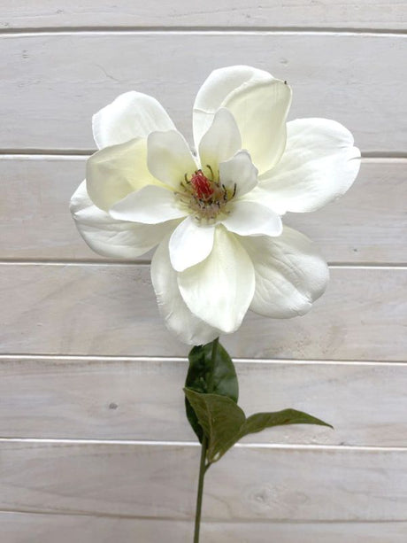Artificial white magnolia stem with lifelike petals, ideal for elegant floral arrangements and home decor.