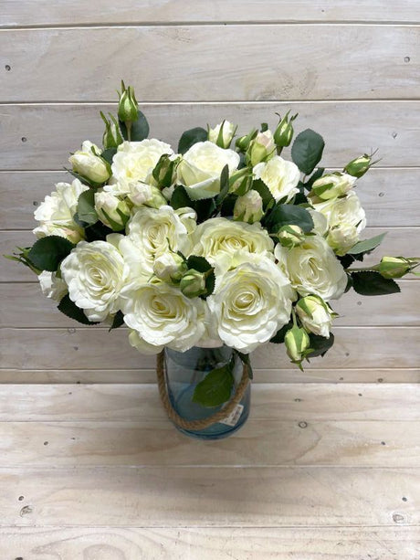 Elegant white artificial rose spray with buds, perfect for decor, events, and floral arrangements without maintenance.