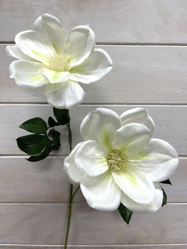Lifelike cream artificial magnolia spray featuring 2 elegant flowers, perfect for home decor and low-maintenance styling.