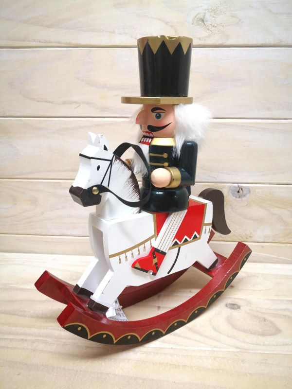 Sleek black Rocking Nutcracker ornament, elegantly crafted for festive holiday decor and modern Christmas displays.