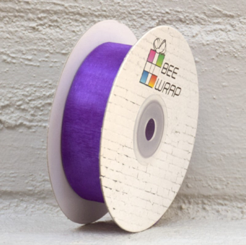 25mm wide violet organza ribbon on a 50m roll, ideal for crafts, gift wrapping, and decorations, adding elegance to projects.