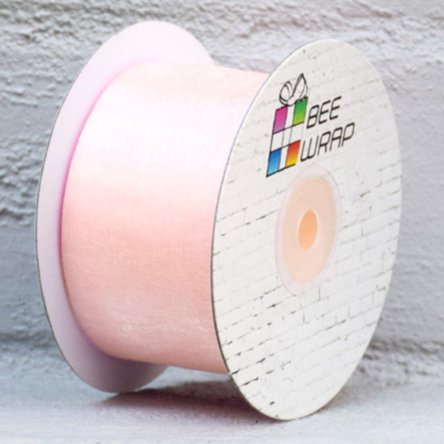 Apricot organza ribbon, 50mm wide and 50m long, perfect for elegant gift wrapping and crafts.