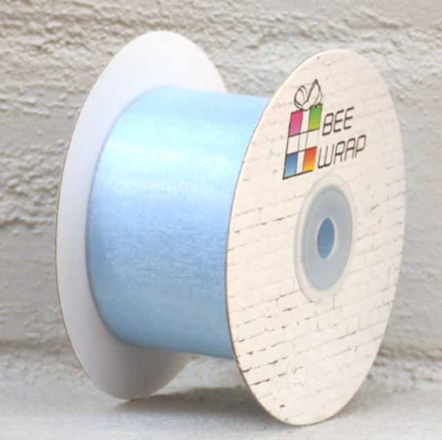 Pale blue organza ribbon, 50mm wide and 50m long, perfect for crafts, gift wrapping, and elegant event decor.