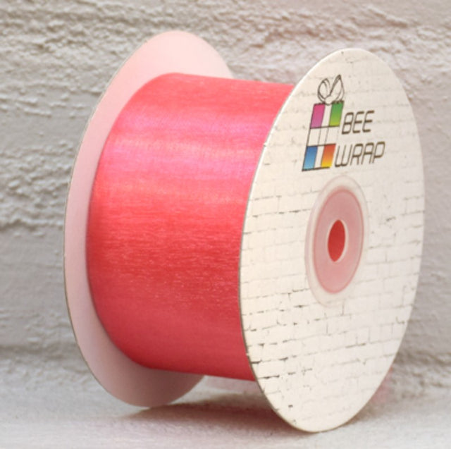 Peach organza ribbon, 50mm wide and 50m long, perfect for elegant gift wrapping and DIY projects.