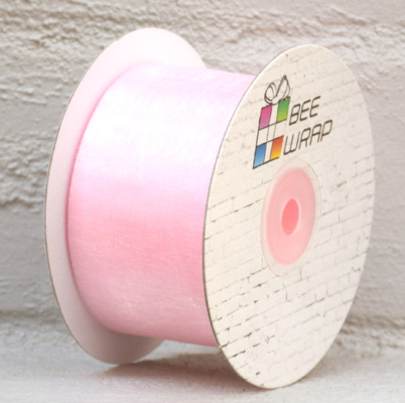 Pale pink organza ribbon, 50mm x 50m, perfect for gifts, events, and DIY projects, adds elegance and versatility.