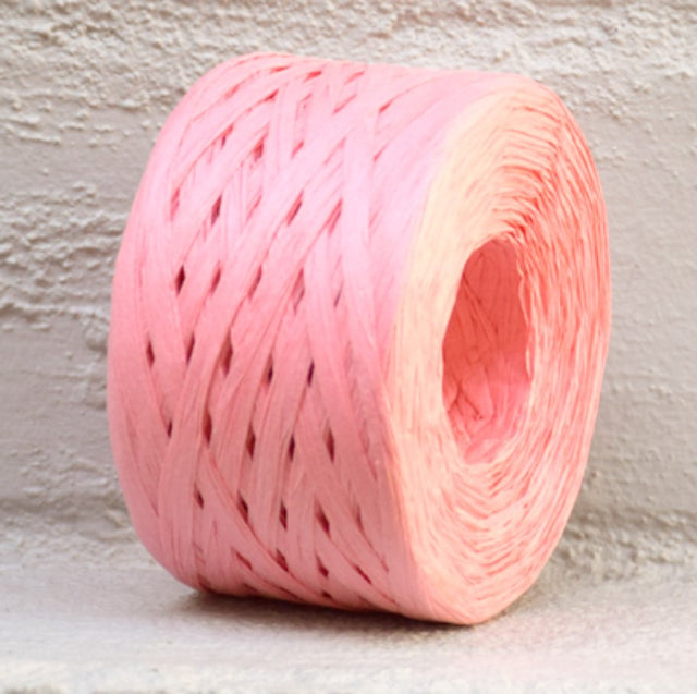 Paper raffia ribbon in vibrant peach, 4mm wide and 100m long, ideal for crafting, gift wrapping, and floral arrangements.