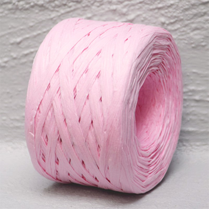 Pale pink 4mm x 100m paper raffia ribbon, ideal for crafting, gift wrapping, and floral arrangements.