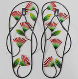 Set of 2 metal wall hangings featuring colorful jandal design with pohutukawa flowers, ideal for indoor and outdoor decor.