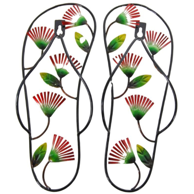 Metal wall hangings featuring jandal design and vibrant pohutukawa blooms, perfect for Kiwi-themed decor.