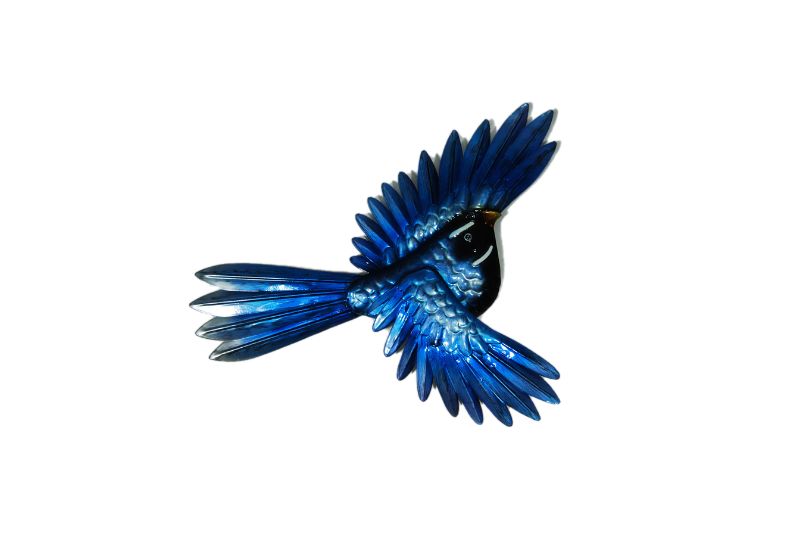 Metal wall art featuring a gracefully soaring fantail, perfect for nature lovers and enhancing home decor.