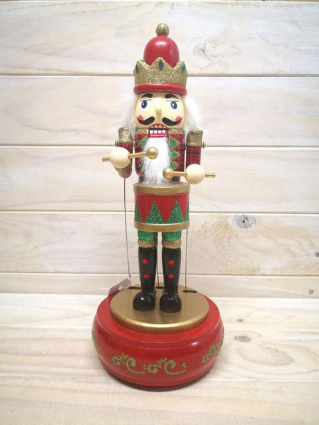 Vibrant red Musical Nutcracker ornament, adding charm and festive melodies to your holiday decor.