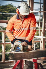 Unisex Hi-Vis segmented long sleeve polo in orange and navy, featuring moisture-wicking fabric and a chest pocket for essentials.