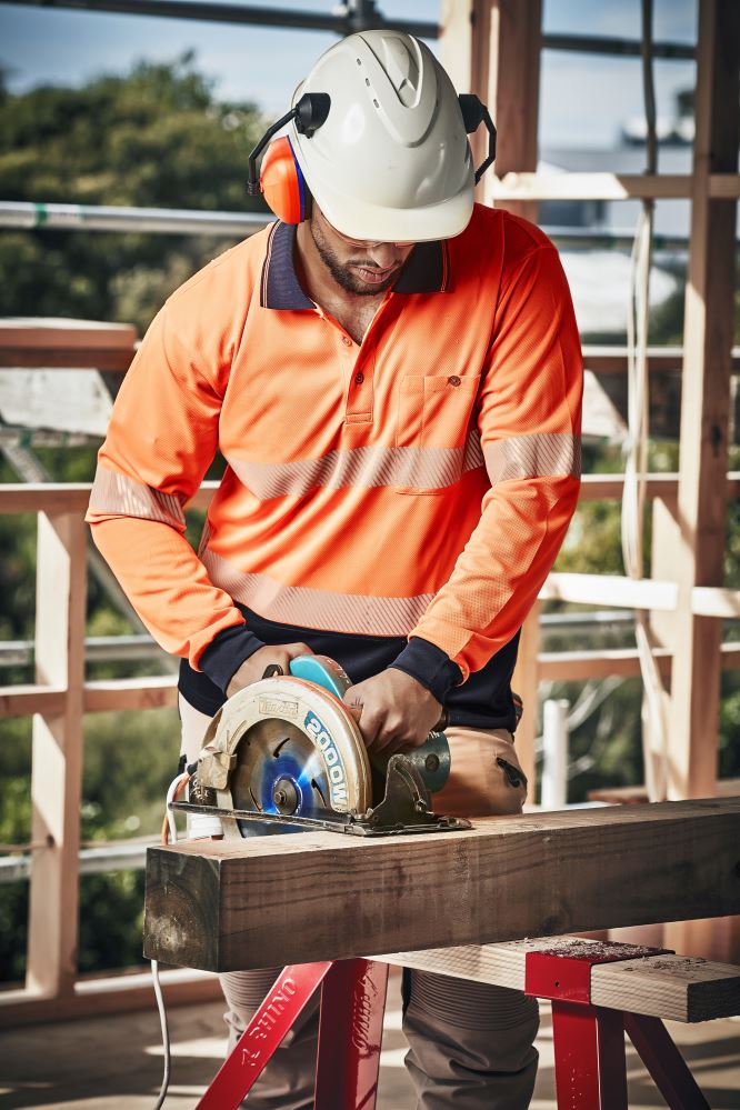 Unisex Hi-Vis Segmented Long Sleeve Polo in orange and navy, featuring moisture-wicking, breathable fabric and a chest pocket.