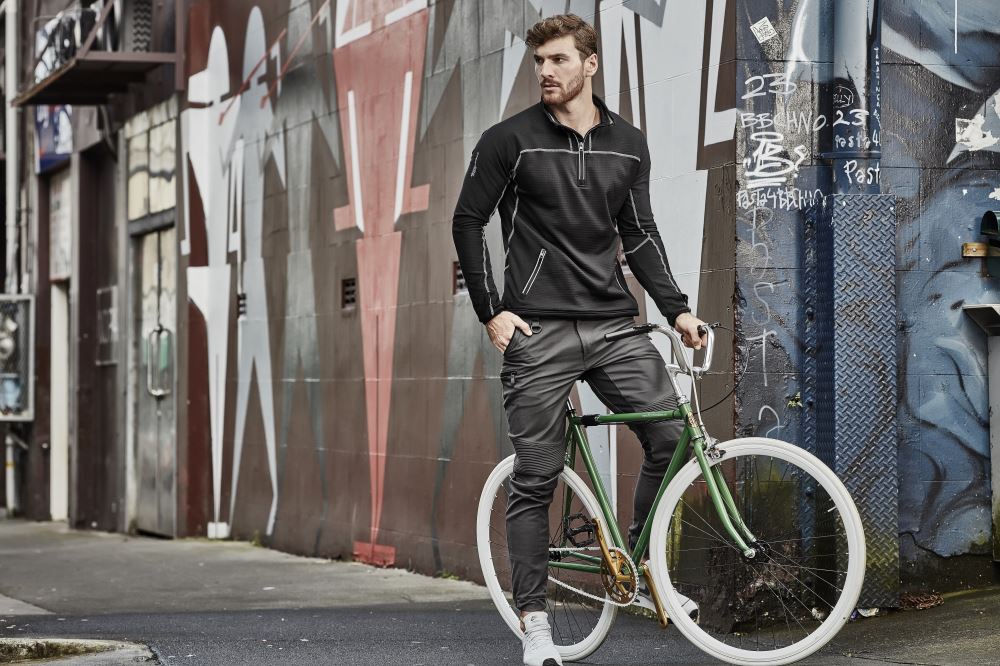 Men's slim-fit khaki stretch pants with 4-way stretch panels, multiple pockets, and lightweight fabric for comfort and mobility.