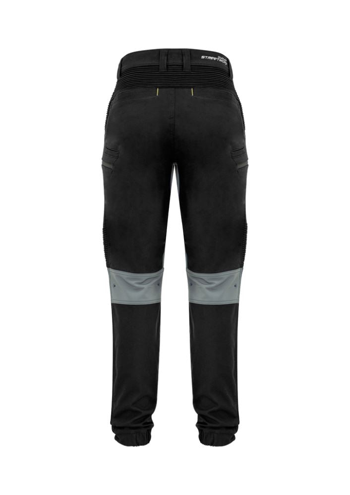 Men's black stretch pants with modern slim fit, elastic cuffs, 4-way stretch panels, and multiple secure pockets.