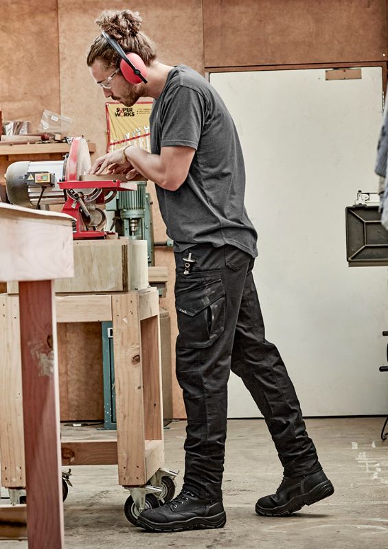 Men's khaki stretch work pants with ripstop fabric, double-layer knees, and multiple pockets for tools and essentials.