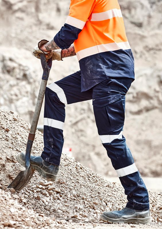 Men's navy cargo pants with stretch fabric, reflective tape, multiple pockets, and a modern slim fit, ideal for work and outdoor use.