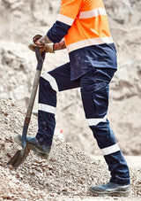 Navy cargo pants for men with reflective tape, oversized pockets, and slim fit, designed for comfort and functionality.