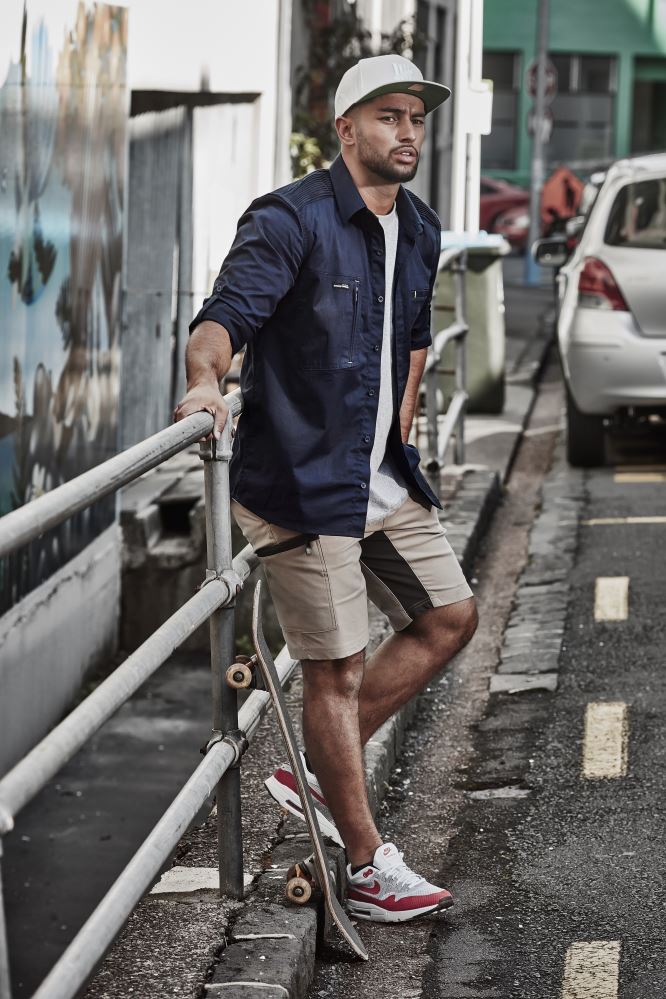 Navy stretch shorts for men featuring 4-way stretch, multiple pockets, and reflective details for comfort and functionality.