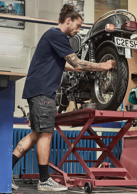 Men's black rugged cooling stretch shorts, size 77, featuring durable ripstop fabric and multiple pockets for tools and essentials.