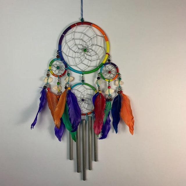 Colorful 4-hoop dreamcatcher windchime, 12cm, adds whimsy and soothing sounds to gardens or homes.