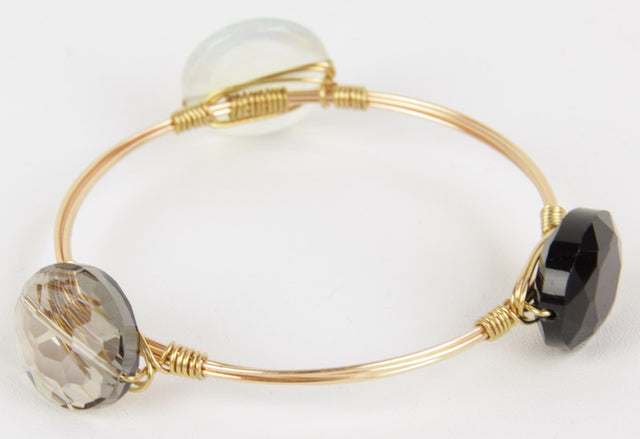 Brown crystal bracelet featuring moonstone and stones, symbolizing harmony and enhancing personal energy.