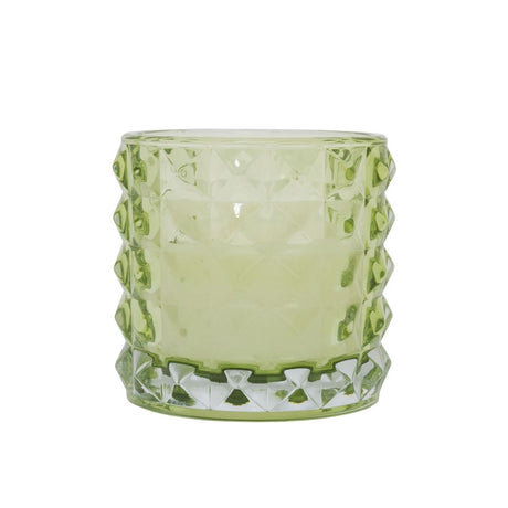 Vibrant lime glass candle holder with candle, designed for elegance and enhancing any decor, perfect for ambiance and relaxation.