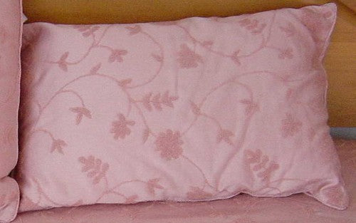 Stylish pink pillow measuring 70 x 45cm, perfect for adding comfort and color to any living space.