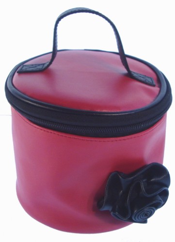 Chic red soft case with black rose, sleek handle, and leopard satin lining, perfect for travel and organization.