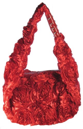 Burgundy satin bag with an elegant rose handle, perfect for any occasion and designed for fashion-forward individuals.
