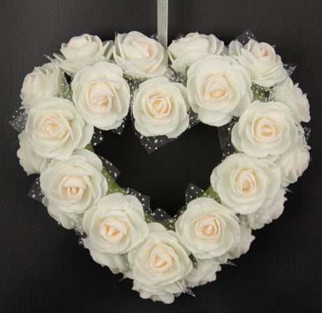 Small pink rose heart wreath, 16H x 17W x 5D, perfect for home decor and special occasions, symbolizing love and elegance.