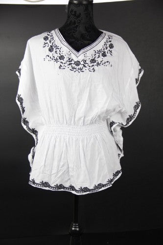 Elegant white kaftan made from 100% viscose, ideal for summer outings and versatile styling from casual to glamorous.