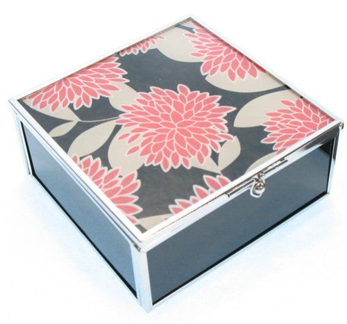 Floral glass box in red and black, perfect for organizing jewelry and keepsakes while enhancing home decor.