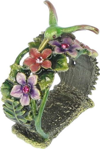 Antique brass napkin holder with floral design, enhancing table decor while keeping napkins organized for any occasion.