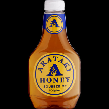 Golden Arataki Squeeze Me Honey in a 500g squeezable bottle, perfect for drizzling on food or sweetening beverages.