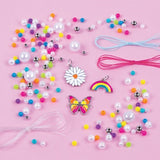 Vibrant DIY bracelet kit for tweens, featuring colorful beads, charms, and organized PlayTray for creative fun.