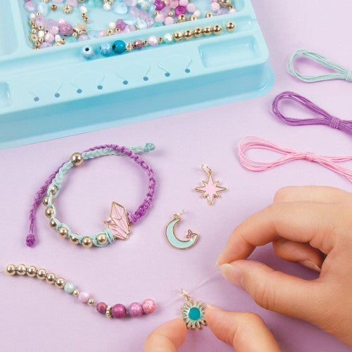 Colorful bracelet-making kit for tweens, featuring cords, 260 beads, charms, and a PlayTray for organized crafting.