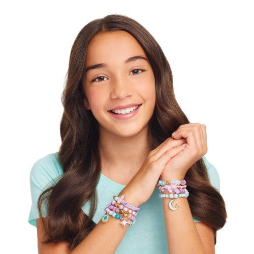 Colorful bracelet-making kit for creative tweens, featuring cords, 260 beads, charms, and a PlayTray for easy organization.